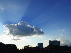 Time-lapse: Cityscape Silhouette with Sunbeam from the Clouds Stock Footage