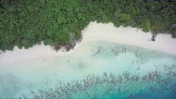 Desert island in the Burmese archipelago with a fringing coral reef and white sand Stock Footage