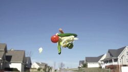 Slow Motion of Tossing Vegetable into Sky with Homes in The Background Stock Footage