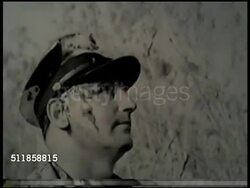 1937: JAPANESE AGGRESSION: DRAMATIZATION: Man in US Navy uniform w/ 'blood' on face looking up. PANAY CAUSALITIES: WS Three covered bodies on stretchers being carried by soldiers down path, housing BG. Instructional Video