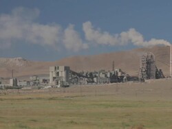 Cement Factory on the green field wide shot Stock Footage