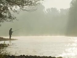 HD DOLLY: Fishing By The Misty River Stock Footage