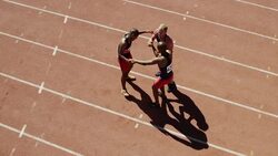 Exhausted male runners on track Stock Footage