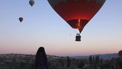 hot air balloons in the air  from within the valley in Cappadocia Stock Footage