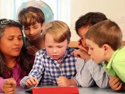 MS Group of students working with their teacher on an tablet / Santa Fe, New Mexico, United States Stock Footage
