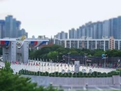 WS T/L View of various national flag swaying in  breeze at  Peace Gate of Olympic park / Seoul, South Korea Stock Footage