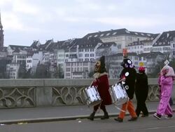 MS Shot of people wearing mask and celebrating in Basel Carnival (Basler Fasnacht) / Basel, Switzerland Stock Footage
