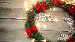Christmas wreath with decorations on the shabby wooden background Stock Footage