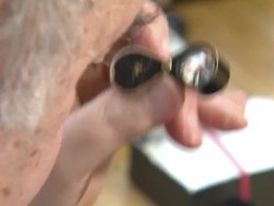 Dealer Inspecting Diamonds News Clip