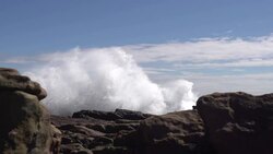 Wave smashing against rocks Stock Footage