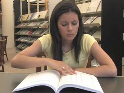 Happy Student in the Library (HD) Stock Footage