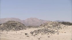 The dried Wadi Kalalat watercourse passes the ruins of Berenike, Egypt. Stock Footage