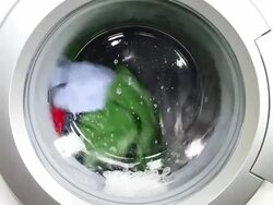 Washing machine and colorful laundry Stock Footage