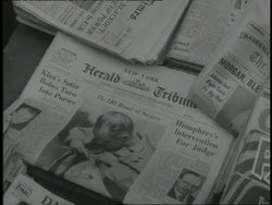 U.S. President Lyndon B. Johnson lifts his shirt in a newspaper photo to show his surgery scar. News Clip