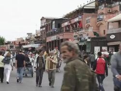 WS View of peoples walking on street with buggy stand at Djemaa El Fnaa / Marrakesh, Morocco Stock Footage