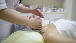cosmetologist doing massage Stock Footage