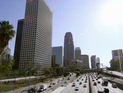 Wide pan of sky scrapers and traffic from bridge in Los Angeles. Stock Footage
