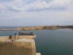 Valletta, Monument of the Unknown Soldier at the Siege Bell Memorial, overlooking the grant harbour Stock Footage