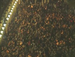MS Masses of people at town square Esplanade on easter celebration at night AUDIO / Kerkyra, Corfu, Greece Stock Footage