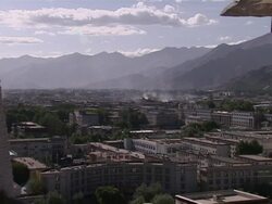 Pilgrims at the Potala Palace and Lhasa skyline News Clip