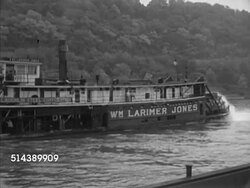 1952: MONONGAHELA RIVER: ALLEGHENY PLATEAU: WS TRACKING 'Wm Larimer Jones' paddle steamer (steamboat, towboat) moving along the Mon river, paddle wheels turning in water. Riverboat, ship, ferry, steamship Instructional Video