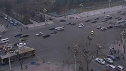 A traffic patrol officer directs traffic on a city street in Beijing, China. Stock Footage