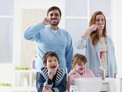HD: Cheerful Family Brushing Teeth Together. Stock Footage