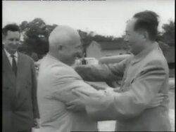 Chinese Chairman Mao Tse Tung and Soviet Premier Nikita Khrushchev hug and shake hands. News Clip