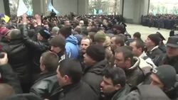 Crimean Tatars and Pro-Russian activists clased outside a local parliament building in Ukraine's Crimean peninsula. (Feb. 26) Instructional Video