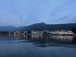 Lake Iseo skyline - lights reflections on water during sunset Stock Footage