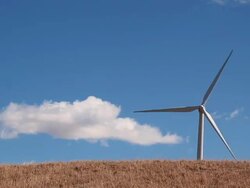 Wind Turbine Peeking Over Hillside Stock Footage