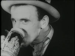 Entertainer Jimmy Durante enjoys a mug of beer, marking the repeal of Prohibition. News Clip