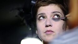 Blue-eyed Girl Enjoying Stage Make-up Stock Footage