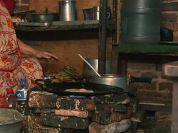Nepali woman cooking Nepali food. Stock Footage
