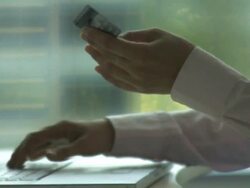 Female performing credit card transaction on laptop; UK Stock Footage