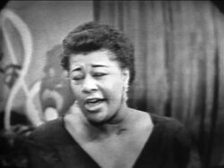 B/W 1955 close up Ella Fitzgerald singing "Between the Devil + Deep Blue Sea" / The Larry Finley Show Stock Footage