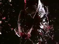 CU SLO MO Glass of red wine breaking and splashing / Vieux, Normandy, France    Stock Footage