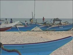 Relatives, friends of tsunami victims light oil lamps Instructional Video