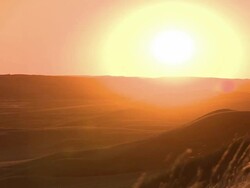 An orange sun beating down on the prairies Stock Footage