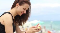 Beautiful young woman taking a photo herself Stock Footage