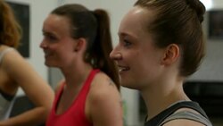 Crossfit athletes listening to their trainer Stock Footage