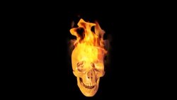 An animation of a burning skull rotates against a black screen. Stock Footage