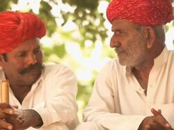 Two rajasthani senior men talking, Jaisalmer, Rajasthan, India Stock Footage