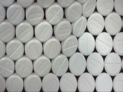 SLOMO CU Wall of paracetamol pills falling forward Stock Footage