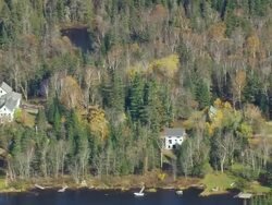 WS ARIEAL View of Houses in town in front of Flagstaff lake / Maine, United States Stock Footage