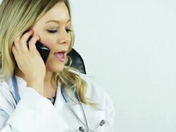 Female Doctor Talking on a Cell Phone Stock Footage