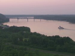 WS Boat moving in Hannibal Mississippi river at sunset / Hannibal, Missouri, United States Stock Footage