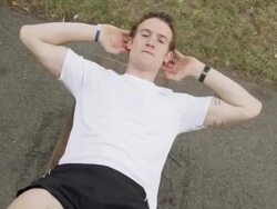 Male doing sit-ups in park Stock Footage