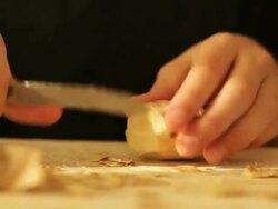 Boy slicing ginger Stock Footage