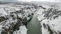 HD time-lapse: Winter landscape, river and cliff at northern Iceland Stock Footage
